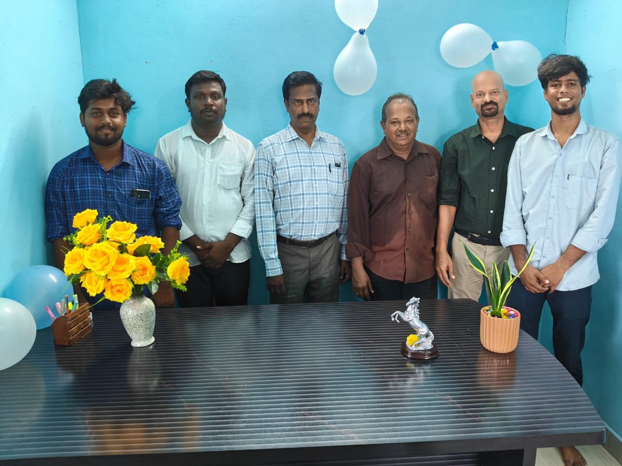 Yehova Properties team members standing together at the company office